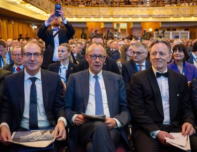 12 March 2026, Hesse, Wiesbaden: German Chancellor Friedrich Merz, German Interior Minister Alexander Dobrindt, and BKA President Holger Münch sit together at the Wiesbaden Kurhaus during a ceremony marking the 75th anniversary of the Federal Criminal Police Office. Photo: Soeren Stache/dpa