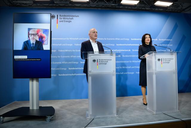 13 March 2026, Berlin: Katherina Reiche (R), Germany's Minister for Economic Affairs and Energy, together with Peter Leibinger (L, via video link), President of the Federation of German Industries (BDI), and Juergen Kerner, Deputy Chairman of IG Metall, at a press conference at the Federal Ministry of Economics following the top-level meeting of the Future of Industry Alliance and the presentation of its joint policy paper. Photo: Bernd von Jutrczenka/dpa