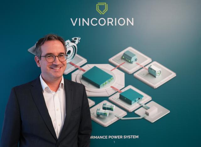 FILED - 23 October 2024, Schleswig-Holstein, Wedel: Kajetan von Mentzingen, Managing Director of Vincorion Advanced Systems GmbH, stands in front of the company logo of the mechanical engineering company Vincorion Advanced Systems GmbH. Photo: Marcus Brandt/dpa