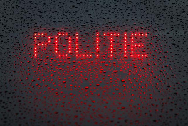 FILED - 16 March 2023, Lower Saxony, Bad Bentheim: The Dutch word "Politie" ("Police") is displayed on the rear window of an emergency vehicle. A fire was deliberately set outside the entrance of a synagogue in Rotterdam, police in the Dutch port city said on Friday. Photo: Friso Gentsch/dpa