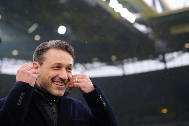 14 March 2026, North Rhine-Westphalia, Dortmund: Borussia Dortmund's coach Niko Kovac removes his headphones after a TV interview ahead of the German Bundesliga soccer match between Borussia Dortmund and FC Augsburg at Signal Iduna Park. Photo: Bernd Thissen/dpa - WICHTIGER HINWEIS: Gemäß den Vorgaben der DFL Deutsche Fußball Liga bzw. des DFB Deutscher Fußball-Bund ist es untersagt, in dem Stadion und/oder vom Spiel angefertigte Fotoaufnahmen in Form von Sequenzbildern und/oder videoähnlichen Fotostrecken zu verwerten bzw. verwerten zu lassen.