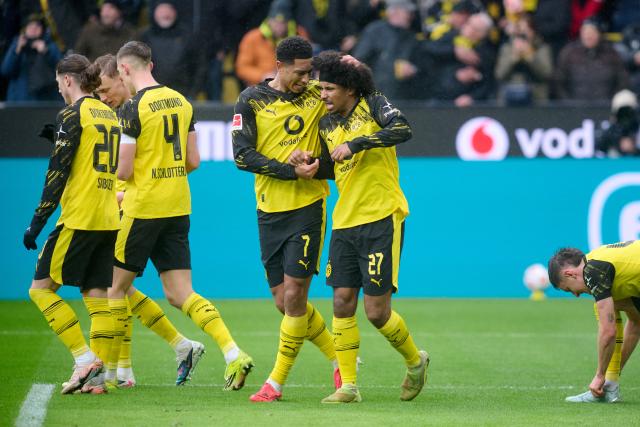 14 March 2026, North Rhine-Westphalia, Dortmund: Borussia Dortmund's Karim Adeyemi celebrates scoring his side's first goal with Jobe Bellingham during the German Bundesliga soccer match between Borussia Dortmund and FC Augsburg at Signal Iduna Park. Photo: Bernd Thissen/dpa - IMPORTANT NOTICE: DFL and DFB regulations prohibit any use of photographs as image sequences and/or quasi-video.