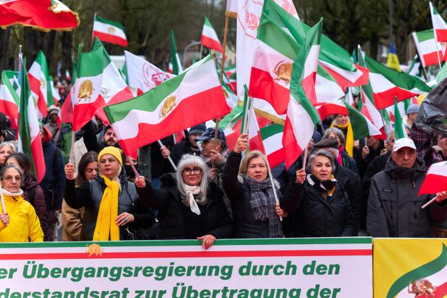 14 March 2026, Hamburg: Iranians in exile take part in a rally organized by the National Resistance Council of Iran (NWRI) against Iranian regime. Photo: Marcus Golejewski/dpa