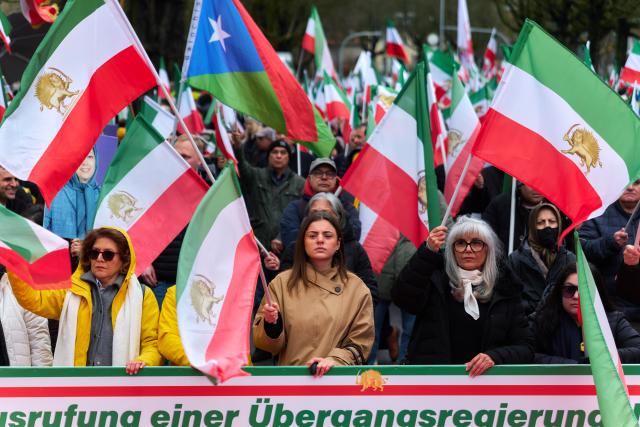 14 March 2026, Hamburg: Iranians in exile take part in a rally organized by the National Resistance Council of Iran (NWRI) against Iranian regime. Photo: Marcus Golejewski/dpa