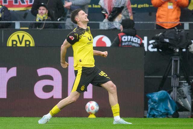 14 March 2026, North Rhine-Westphalia, Dortmund: Dortmund's Luca Reggiani celebrates scoring his side's second goal during the German Bundesliga soccer match between Borussia Dortmund and FC Augsburg at Signal Iduna Park. Photo: Bernd Thissen/dpa - IMPORTANT NOTICE: DFL and DFB regulations prohibit any use of photographs as image sequences and/or quasi-video.
