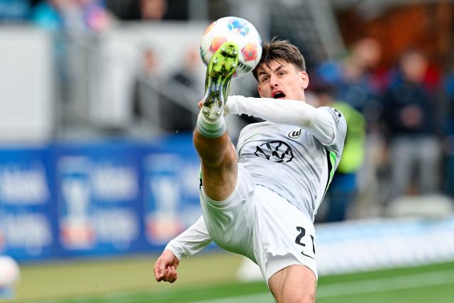 14 March 2026, Baden-Württemberg, Sinsheim: Wolfsburg's Joakim Maehle in action during the German Bundesliga soccer match between TSG 1899 Hoffenheim and VfL Wolfsburg at the PreZero Arena. Photo: Uwe Anspach/dpa - IMPORTANT NOTICE: DFL and DFB regulations prohibit any use of photographs as image sequences and/or quasi-video.