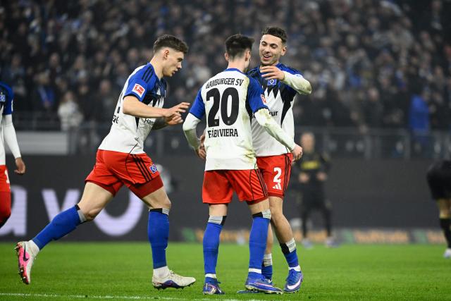 14 March 2026, Hamburg: Hamburger's Fabio Vieira  celebrates scoring his side's first goal with teammate William Mikelbrencis during the German Bundesliga soccer match between Hamburger SV and 1. FC Cologne at the Volksparkstadion. Photo: Gregor Fischer/dpa - IMPORTANT NOTICE: DFL and DFB regulations prohibit any use of photographs as image sequences and/or quasi-video.