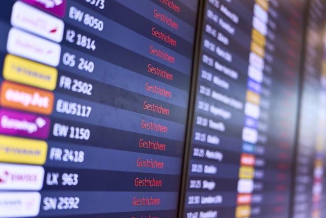 18 March 2026, Brandenburg, Schoenefeld: An information board at Berlin Brandenburg Airport (BER) displays all flights as canceled. Due to a warning strike by the Verdi union, no passenger planes take off or land at BER, with all departures and arrivals canceled for the entire day, as previously announced by the airport operator. Photo: Michael Ukas/dpa