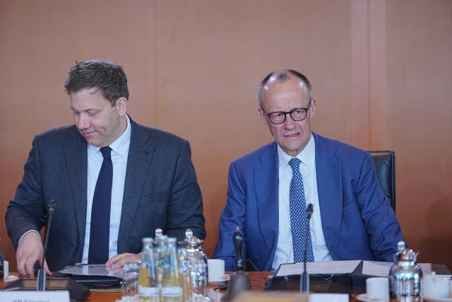 18 March 2026, Berlin: Germany's Chancellor Friedrich Merz (R) sits next to Lars Klingbeil, Germany's Minister of Finance, ahead of the Federal Cabinet meeting at the Chancellery. French Foreign Minister Jean-Noel Barrot attends the meeting as a guest. Photo: Michael Kappeler/dpa