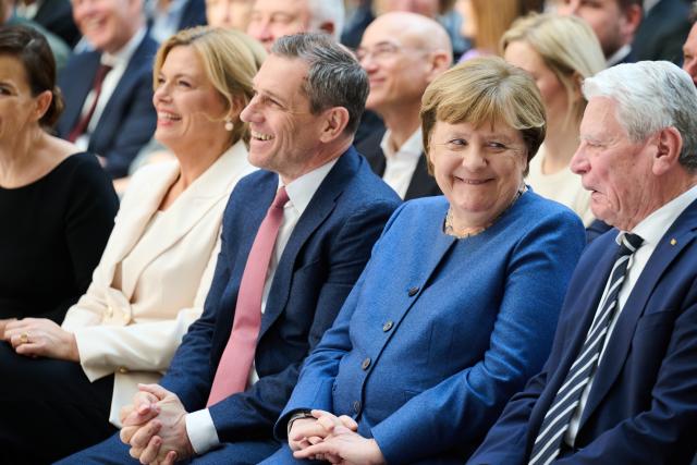 18 March 2026, Berlin: (L-R) Julia Kloeckner, President of the Bundestag, Michael Mronz, partner of Guido Westerwelle, Angela Merkel, former German Chancellor, and Joachim Gauk, former German President, sit at the memorial service to mark the 10th anniversary of the death of Free Democratic Party (FDP) politician Guido Westerwelle. Photo: Annette Riedl/dpa