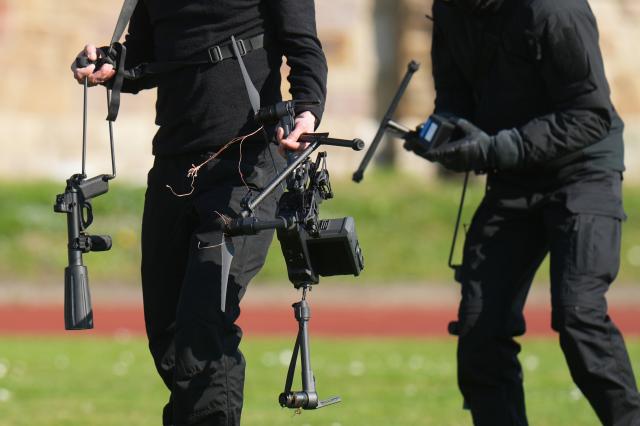 18 March 2026, Rhineland-Palatinate, Lahnstein: Police forces use a net gun to shoot down a drone and secure it as part of the nationwide exercise "GETEX 2026,". State and federal police forces are training alongside the German Armed Forces to coordinate their response to terrorist threats. Photo: Thomas Frey/dpa