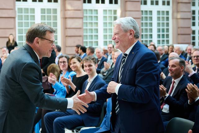 18 March 2026, Berlin: German Foreign Minister Johann Wadephul (L) bids farewell to former German President Joachim Gauck during the memorial service marking the 10th anniversary of the death of the Free Democratic Party (FDP) politician Guido Westerwelle. Photo: Annette Riedl/dpa