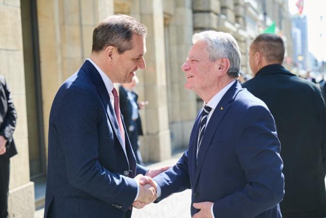 18 March 2026, Berlin: Former German President Joachim Gauck (R) greets Michael Mronz, Former partner of Free Democratic Party (FDP) politician Guido Westerwelle, at the memorial service marking the 10th anniversary of the FDP politician's death. Photo: Annette Riedl/dpa