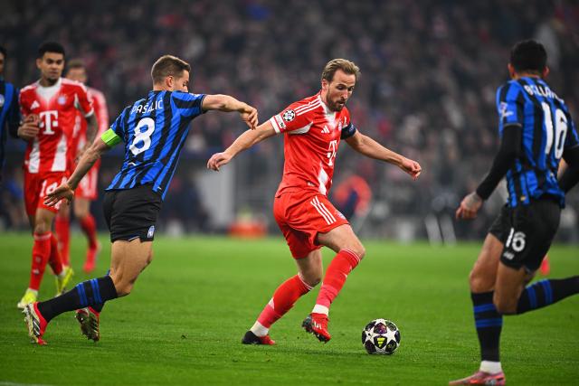 18 March 2026, Bavaria, Munich: Atalanta Bergamo's Mario Pasalic and Bayern Munich's Harry Kane battle for the ball during the UEFA Champions League Round of 16, Second Leg soccer match between Bayern Munich and Atalanta Bergamo at the Allianz Arena. Photo: Tom Weller/dpa