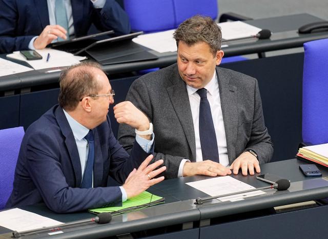 19 March 2026, Berlin: Alexander Dobrindt (L), German Minister of the Interior, speaks with Lars Klingbeil, German Minister of Finance, in the plenary chamber of the Bundestag. Photo: Michael Kappeler/dpa
