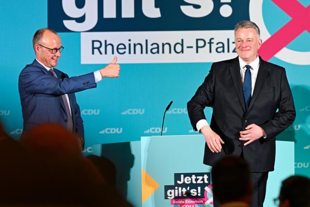 20 March 2026, Rhineland-Palatinate, Bad Duerkheim: German Chancellor Friedrich Merz (L) and Gordon Schnieder, the Christian Democratic Union (CDU) top candidate in the state election in Rhineland-Palatinate, stand on stage in the Salierhalle at the conclusion of the CDU's state election campaign. Photo: Uwe Anspach/dpa