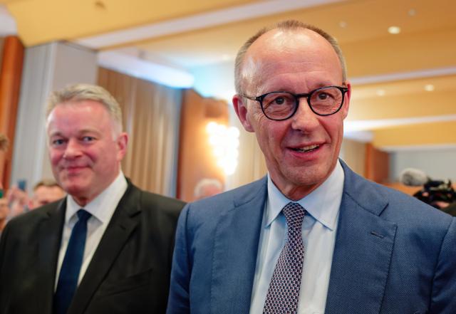 20 March 2026, Rhineland-Palatinate, Bad Duerkheim: German Chancellor Friedrich Merz (R) and Gordon Schnieder, the Christian Democratic Union (CDU) top candidate in the state election in Rhineland-Palatinate, arrive at the Salierhalle for the conclusion of the CDU's state election campaign. Photo: Uwe Anspach/dpa