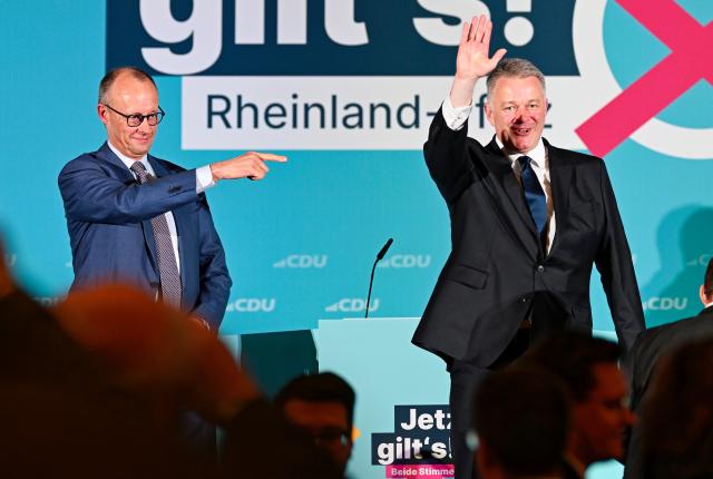20 March 2026, Rhineland-Palatinate, Bad Duerkheim: German Chancellor Friedrich Merz (L) and Gordon Schnieder, the Christian Democratic Union (CDU) top candidate in the state election in Rhineland-Palatinate, stand on stage in the Salierhalle at the conclusion of the CDU's state election campaign. Photo: Uwe Anspach/dpa