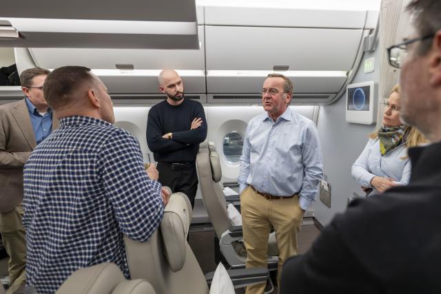 20 March 2026, Brandenburg, Schoenefeld: German Minister of Defense Boris Pistorius (3rd R) speaks with the journalists traveling with him before the start of his military policy trip to Asia. Photo: Peter Kneffel/dpa