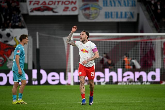 20 March 2026, Saxony, Leipzig: Leipzig's David Raum celebrates his side's second goal during the German Bundesliga soccer match between RB Leipzig and TSG 1899 Hoffenheim at Red Bull Arena. Photo: Julius Frick/dpa