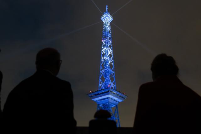 20 March 2026, Berlin: Governing Mayor of Berlin Kai Wegner (L) and Senator for Economic Affairs Franziska Giffey look on as the lights are illuminated during the event marking the start of the "100 Years of the Radio Tower" anniversary year. Photo: Carsten Koall/dpa