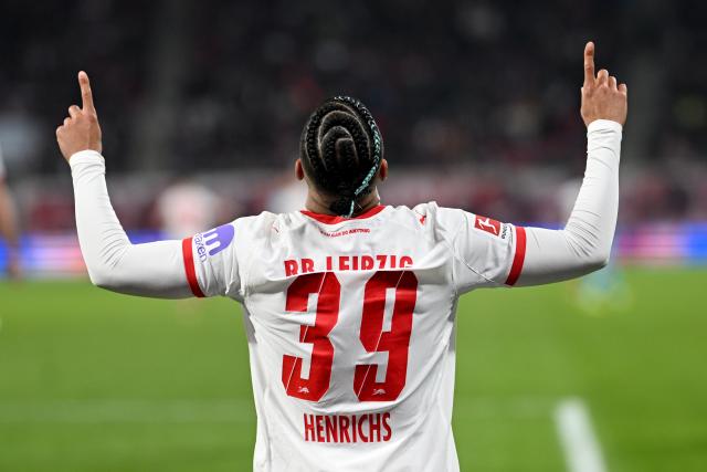 20 March 2026, Saxony, Leipzig: Leipzig's Benjamin Henrichs celebrates scoring his side's fifth goal during the German Bundesliga soccer match between RB Leipzig and TSG 1899 Hoffenheim at Red Bull Arena. Photo: Julius Frick/dpa