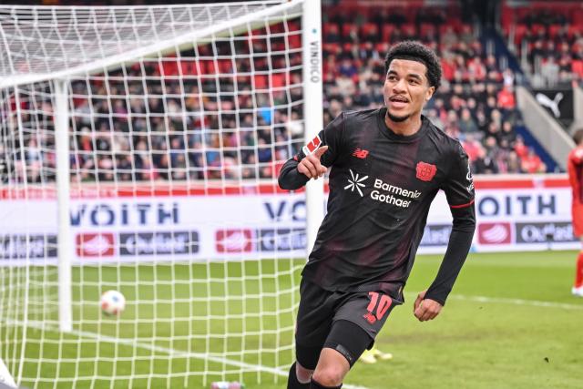 21 March 2026, Baden-Wuerttemberg, Heidenheim: Bayer Leverkusen's Malik Tillman celebrates scoring his sides first goal during the German Bundesliga soccer match between 1. FC Heidenheim and Bayer Leverkusen at Voith-Arena. Photo: Harry Langer/dpa - WICHTIGER HINWEIS: Gemäß den Vorgaben der DFL Deutsche Fußball Liga bzw. des DFB Deutscher Fußball-Bund ist es untersagt, in dem Stadion und/oder vom Spiel angefertigte Fotoaufnahmen in Form von Sequenzbildern und/oder videoähnlichen Fotostrecken zu verwerten bzw. verwerten zu lassen.
