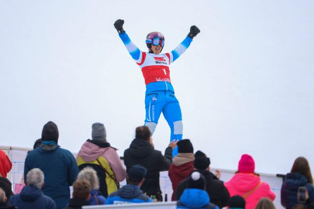 21 March 2026, North Rhine-Westphalia, Winterberg: South Korea's Lee Sang-ho celebrates in front of the crowd after winning the Men's Parallel Slalom of the FIS Snowboard World Cup in Winterberg. Photo: Christoph Reichwein/dpa
