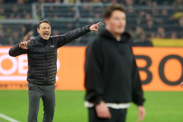 21 March 2026, North Rhine-Westphalia, Dortmund: Borussia Dortmund coach Niko Kovac (L) and Hamburger coach Merlin Polzin stand on the sidelines during the German Bundesliga soccer match between Borussia Dortmund and Hamburger SV at Signal Iduna Park. Photo: Bernd Thissen/dpa - WICHTIGER HINWEIS: Gemäß den Vorgaben der DFL Deutsche Fußball Liga bzw. des DFB Deutscher Fußball-Bund ist es untersagt, in dem Stadion und/oder vom Spiel angefertigte Fotoaufnahmen in Form von Sequenzbildern und/oder videoähnlichen Fotostrecken zu verwerten bzw. verwerten zu lassen.