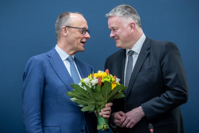 23 March 2026, Berlin: Gordon Schnieder, top candidate of the Christian Democratic Union (CDU) in the Rhineland-Palatinate state elections, receives flowers from German Chancellor Friedrich Merz, before the meeting of the CDU Federal Executive Committee at the Konrad Adenauer House. Photo: Michael Kappeler/dpa