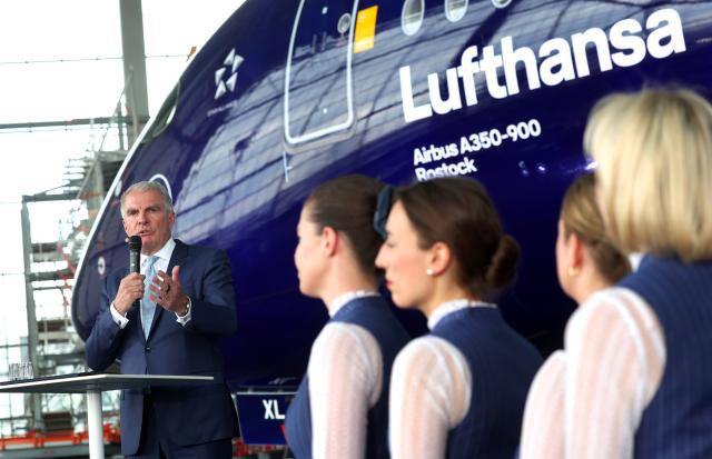 23 March 2026, Bavaria, Munich: Carsten Spohr, Chairman of the Executive Board and CEO of Deutsche Lufthansa, speaks in front of the Airbus A350-900 Rostock during the celebration of Lufthansa's 100th anniversary. Photo: Karl-Josef Hildenbrand/dpa