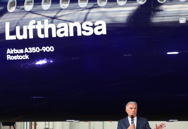 23 March 2026, Bavaria, Munich: Carsten Spohr, Chairman of the Executive Board and CEO of Deutsche Lufthansa, speaks in front of the Airbus A350-900 Rostock during the celebration of Lufthansa's 100th anniversary. Photo: Karl-Josef Hildenbrand/dpa