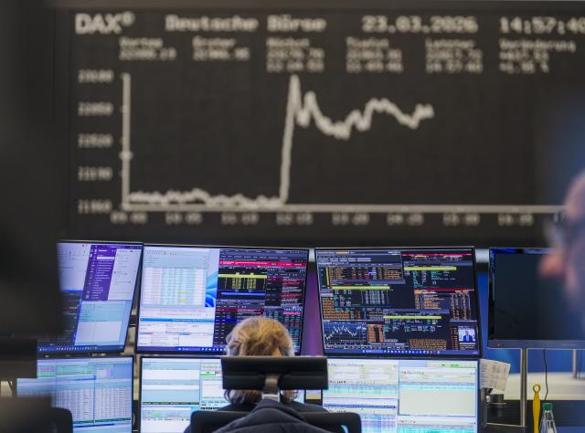 23 March 2026, Hesse, Frankfurt_Main: The daily performance of the German share index (Dax) can be seen on the large display board above the trading floor. Photo: Andreas Arnold/dpa