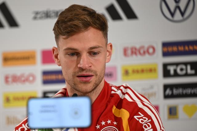 24 March 2026, Bavaria, Herzogenaurach: Germany's Joshua Kimmich speaks during a press conference of the German National team ahead of the international friendly match against Switzerland. Photo: Federico Gambarini/dpa - IMPORTANT NOTE: In accordance with the regulations of the DFL German Football League and the DFB German Football Association, it is prohibited to utilize or have utilized photographs taken in the stadium and/or of the match in the form of sequential images and/or video-like photo series.