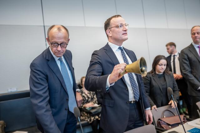 24 March 2026, Berlin: German Chancellor Friedrich Merz (L) stands next to Jens Spahn, CDU/CSU parliamentary group leader in the Bundestag, at the start of the parliamentary group meeting of the Christian Democratic Union in the German Parliament (Bundestag). Photo: Michael Kappeler/dpa
