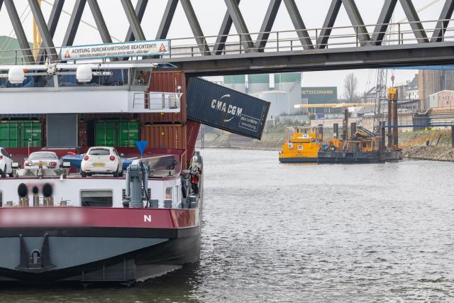 24 March 2026, North Rhine-Westphalia, Neuss: A container ship is docked at the Port of Neuss after colliding with a bridge, causing several containers to fall into the water. Photo: Jan Ohmen/dpa