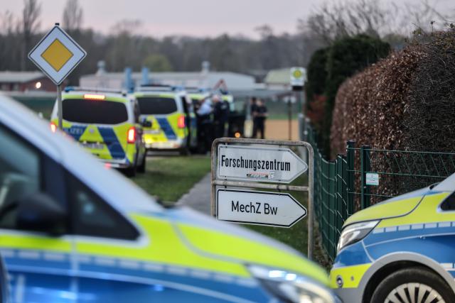 24 March 2026, North Rhine-Westphalia, Jülich: Police vehicles are stationed at the entrance to the Juelich Research Center ahead of Castor transports scheduled to travel through North Rhine-Westphalia from Juelich to Ahaus. Photo: Oliver Berg/dpa