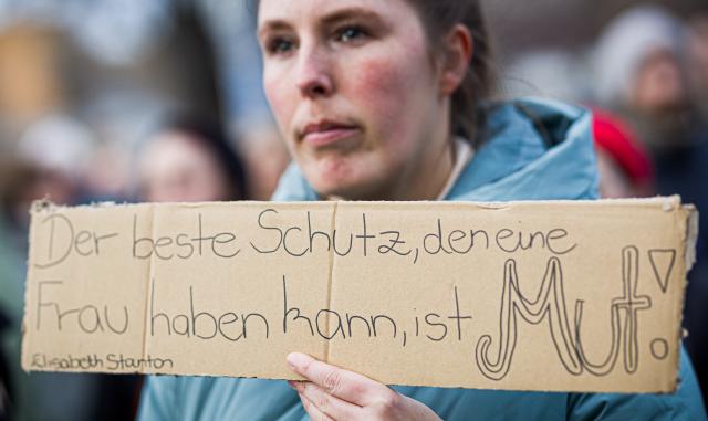 25 March 2026, Lower Saxony, Hanover: A sign bearing the quote 'The best protection a woman can have is courage!' by Elizabeth Cady Stanton is seen at the 'Stop Sexual Violence' rally. Photo: Moritz Frankenberg/dpa