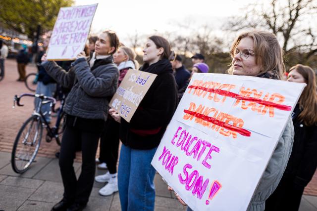 25 March 2026, Lower Saxony, Hanover: A sign bearing the crossed-out words 'Protect your daughter' and the words 'Educate your son!' is seen at the 'Stop Sexual Violence' rally. Photo: Moritz Frankenberg/dpa