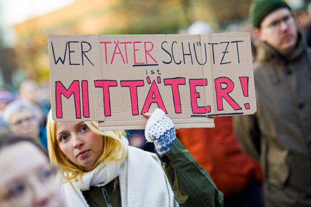 25 March 2026, Lower Saxony, Hanover: A sign reading 'Those who protect perpetrators are accomplices' is seen at the 'Stop Sexual Violence' rally. Photo: Moritz Frankenberg/dpa
