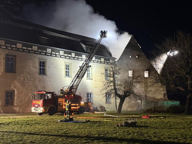 26 March 2026, Thuringia, Weissensee: Firefighters work to extinguish a fire at Runneburg Castle. Parts of the 12th-century castle were damaged in the fire. Photo: Silvio Dietzel/dpa-Zentralbild/dpa