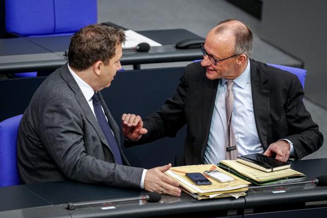 26 March 2026, Berlin: German Chancellor Friedrich Merz (R) talks with Minister of Finance Lars Klingbeil during the plenary session of the German Bundestag. Photo: Kay Nietfeld/dpa