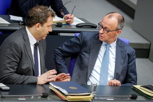 27 March 2026, Berlin: German Chancellor Friedrich Merz Lars Klingbeil,talks to German Minister of Finance, Vice-Chancellor and Social Democratic Party (SPD) Federal Chairman, during the German Parliament (Bundestag) session on the Pension Reform Act in Berlin. Photo: Kay Nietfeld/dpa