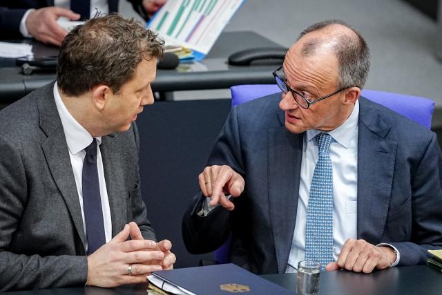 27 March 2026, Berlin: German Chancellor Friedrich Merz Lars Klingbeil,talks to German Minister of Finance, Vice-Chancellor and Social Democratic Party (SPD) Federal Chairman, during the German Parliament (Bundestag) session on the Pension Reform Act in Berlin. Photo: Kay Nietfeld/dpa