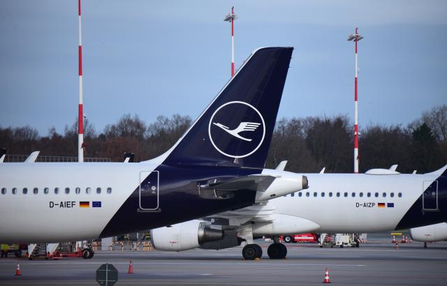 FILED - 13 March 2026, Hamburg: A Lufthansa aircraft is parked at Hamburg Airport. Photo: Daniel Bockwoldt/dpa