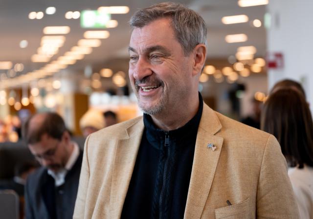 29 March 2026, Hesse, Frankfurt/Main: Bavarian Minister President Markus Soeder, gives a press statement at the airport before his departure for the USA. Photo: Sven Hoppe/dpa