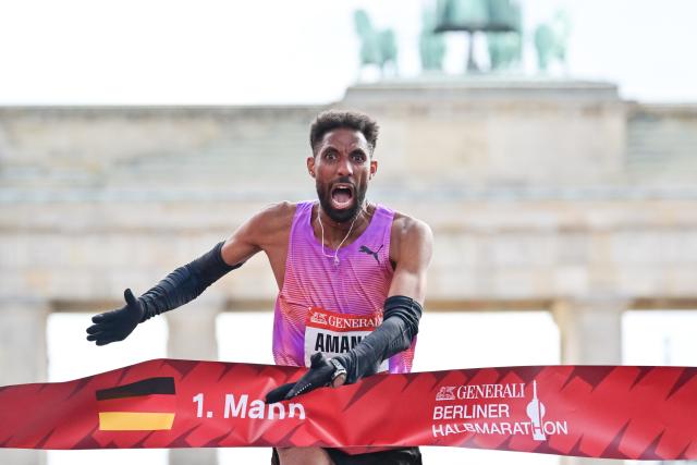 29 March 2026, Berlin: Amanal Petros crosses the finish line third during the Berlin Half Marathon. Photo: Sebastian Christoph Gollnow/dpa