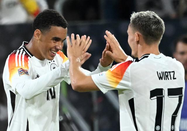 FILED - 07 September 2024, North Rhine-Westphalia, Duesseldorf: Germany's Jamal Musiala (L) celebrates scoring his side's second goal with teammate Florian Wirtz during the UEFA Nations League A group 3 soccer match between Germany and Hungary at Merkur Spiel-Arena. Photo: Fabian Strauch/dpa