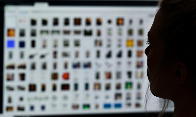 FILED - 15 April 2021, Gießen: A senior detective sits at a computer analyzing data as part of an investigation into child pornography and sexual abuse. Photo: Arne Dedert/dpa