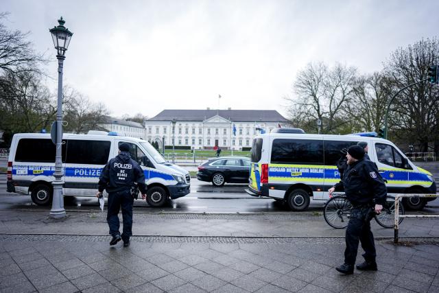 30 March 2026, Berlin: Police cars are parked at Bellevue Palace ahead of the visit of Syria's interim president Ahmed al-Sharaa. Photo: Kay Nietfeld/dpa